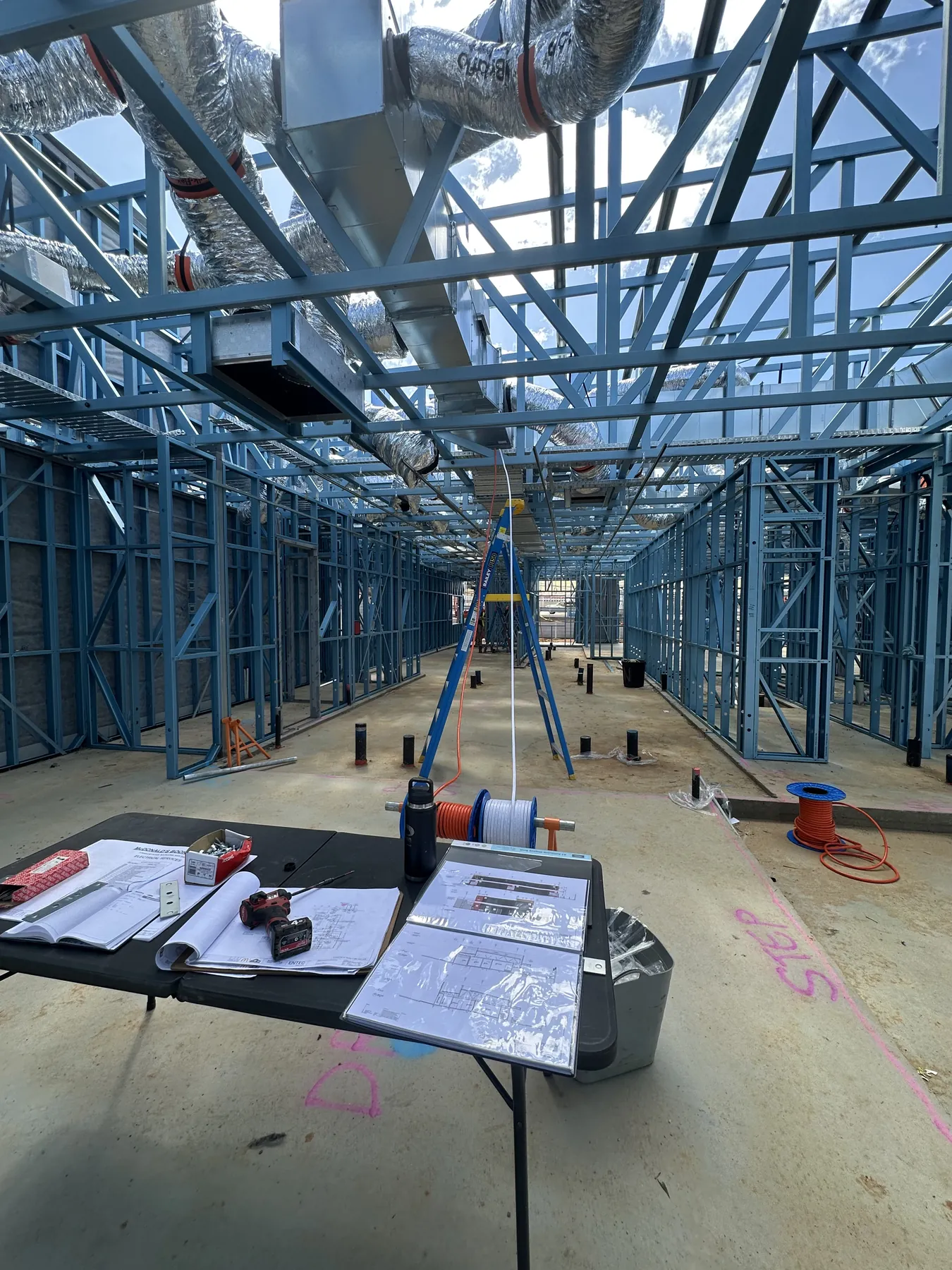 Commercial fit-out rough-in through steel framing